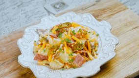 Jalapeno pepper, potato salad with bacon. Food in the retro style of the 20s