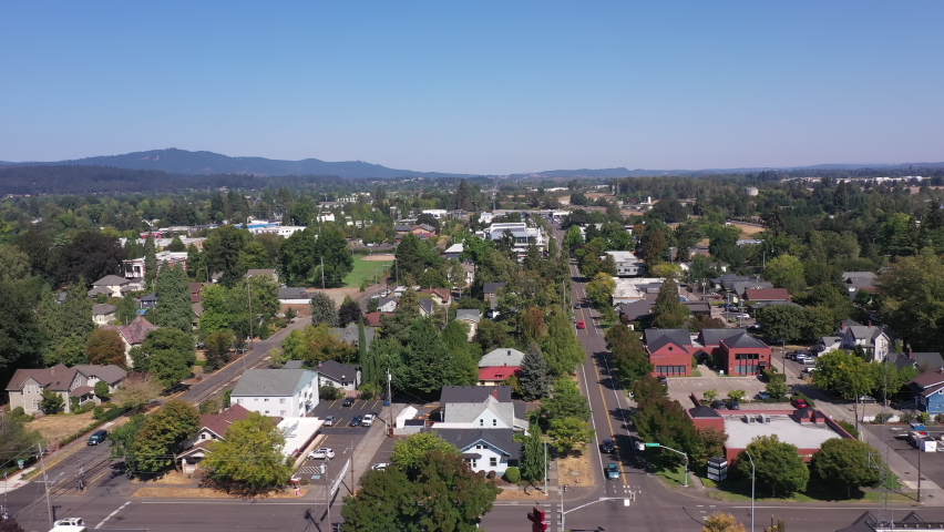 City of Corvallis, Oregon. Drone backwards above small town in the Willamette Valley near Eugene.