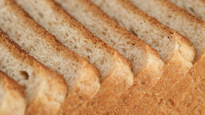 Slices of toast bread close up. Traditional bread for cooking toast | Shutterstock HD Video #1095379301