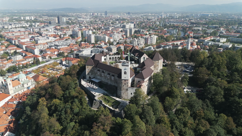 Ljubljana castle, a medieval structure located on the top of Castle hill above the Old city center of Ljubljana, the capital of Slovenia. Aerial shot. Royalty-Free Stock Footage #1095383415