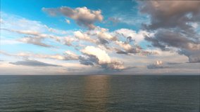 Timelapse of rolling clouds over the sea at sunset