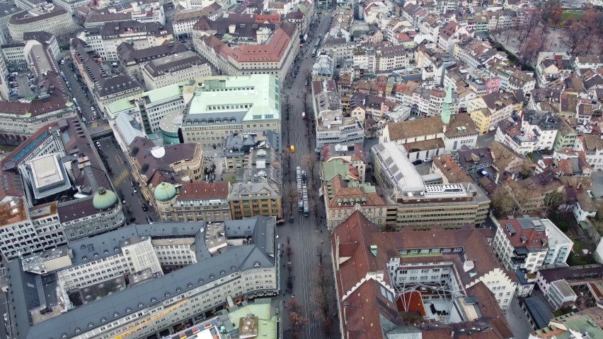 Zurich, Switzerland: Aerial drone footage of the famous Bahnhof street that crosses Zurich business and financial district in Switzerland largest city. 