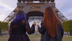 Medium shot of two young girls standing in centre of Paris on sunset, drinking champagne, communicating. Europe travel concept. Friends having fun near Eiffel Tower, clinking glasses. Slow motion - Powered by Shutterstock - Get 15% off with code: PIKWIZARD15