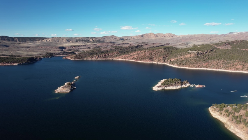 Aerial View of Rocky Islets in Flaming Gorge Water Reservoir Utah Wyoming Border USA, Recreational Area on Sunny Day, Drone Shot
