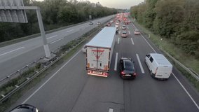 Time lapse video of a traffic jam on a German motorway in the evening during twilight hours
