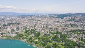 Inscription on video. Lausanne, Switzerland. Flight over the central part of the city. The coast of Lake Geneva. Name is burning, Aerial View, Departure of the camera