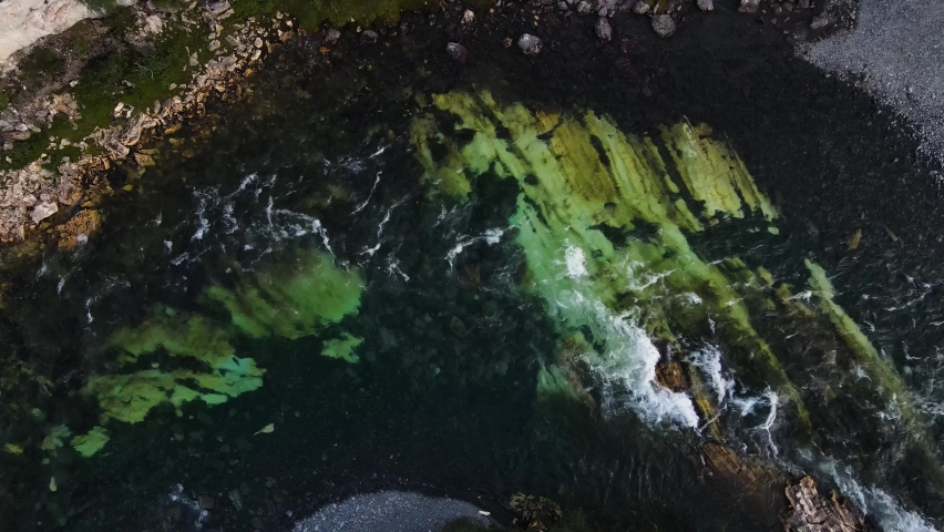 Top-down view of fast-flowing rapids of a mountain stream in Abisko National park, Sweden