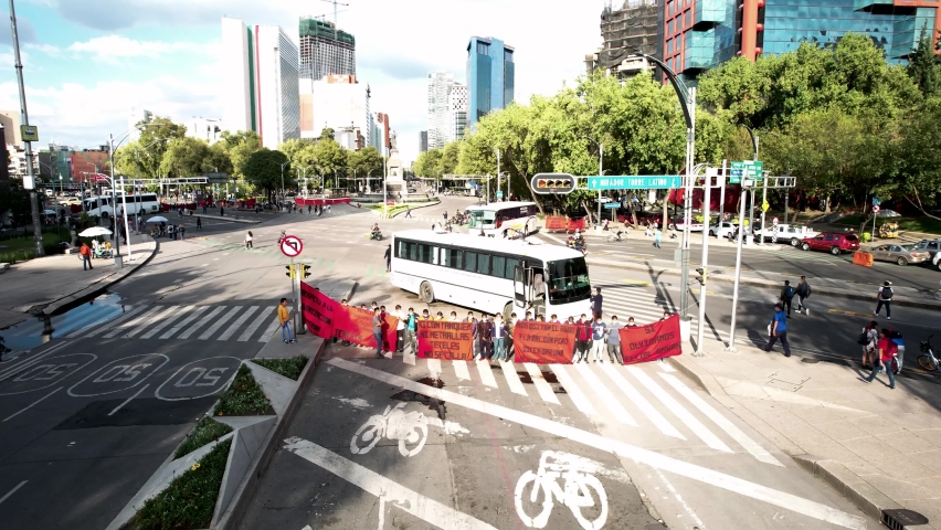 drone shot from the front of a sunset on the paseo de la reforma in mexico city during a student demonstration
