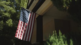 Close up of an American flag on a house. Independence Day - Powered by Shutterstock - Get 15% off with code: PIKWIZARD15