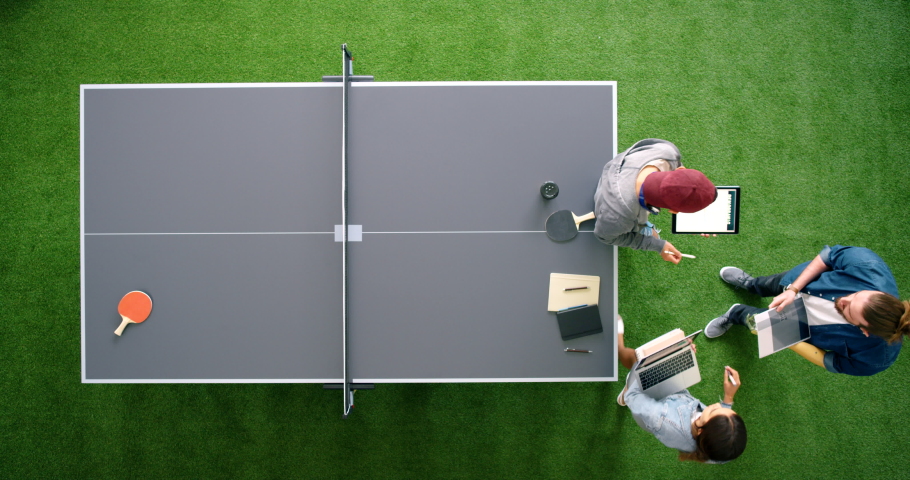 Table tennis, startup business people in meeting for wellness website marketing, website design collaboration and teamwork in workspace. Creative, productivity and staff with multimedia idea strategy