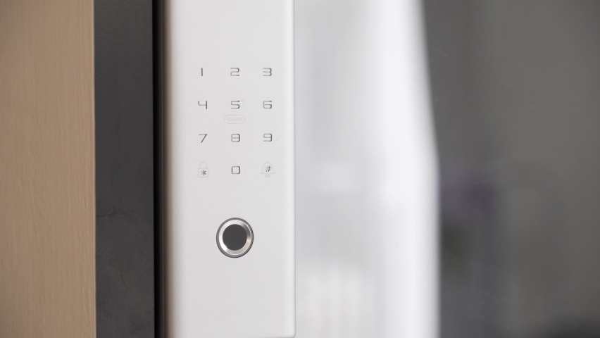 Close Up Footage of Man's hand opens the electronic digital door with a finger scan to access the home security system
 Royalty-Free Stock Footage #1095442969