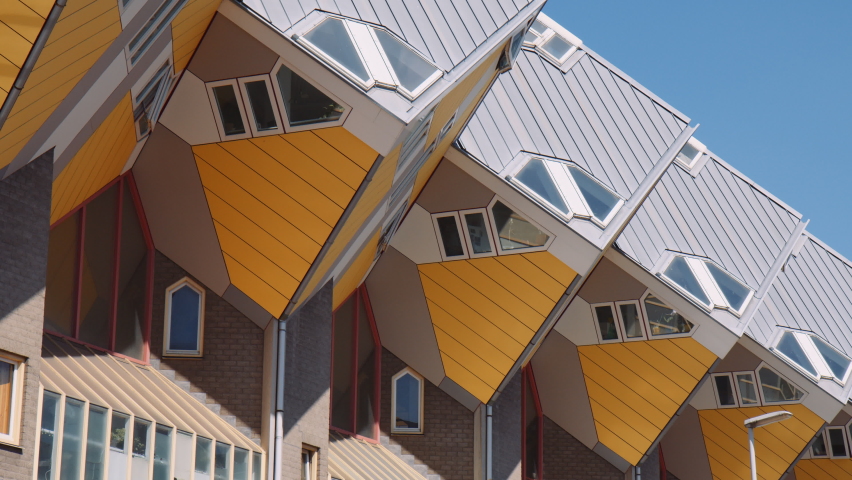 The famous yellow cube houses in Rotterdam on a sunny day. Slow side motion.  Royalty-Free Stock Footage #1095452959