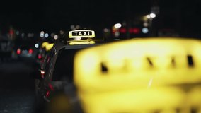 A taxi sign on a car at night on parkingg lot in Cologne, Germany - Powered by Shutterstock - Get 15% off with code: PIKWIZARD15