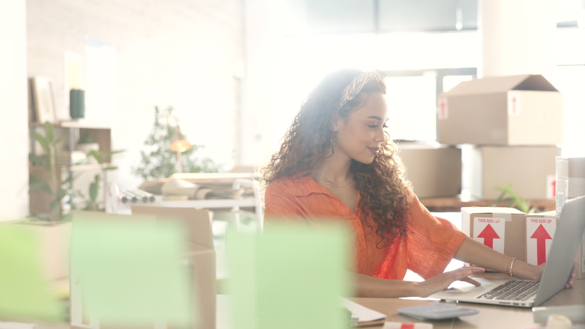 Small business, online order and woman with laptop writing using calculator for profit, inventory or parcel quote on ecommerce website. Entrepreneur female doing courier shipping, selling or delivery