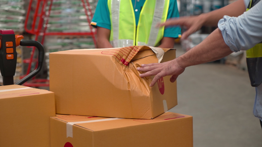 4K, Caucasian senior worker scold staff about unaware carrying packing damaged boxes, chief with hard helmet unacceptable crash broke cardboard box from workers, logistic problem in warehouse factory Royalty-Free Stock Footage #1095470791