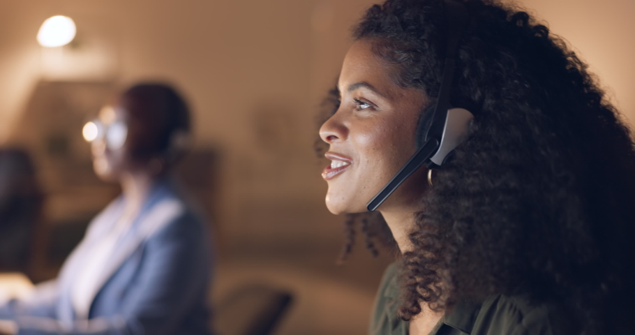 Call center, night and black woman consulting with people online in a dark office. Face of an African customer service worker talking, working and giving support with a headset during overtime | Shutterstock HD Video #1095473481