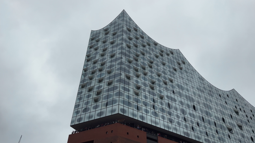 Low angle moving shot of the Elbphilharmonie in Hamburg. Royalty-Free Stock Footage #1095479153