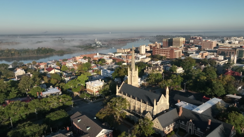 An aerial view of a small US city, as the morning fog rolls in. Royalty-Free Stock Footage #1095481477