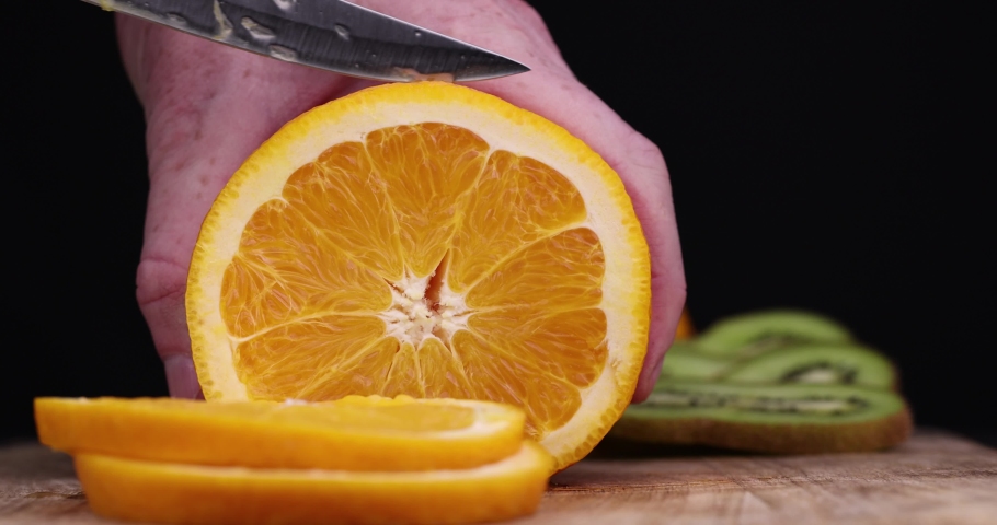 sliced juicy fresh orange, making natural desserts from sweet oranges