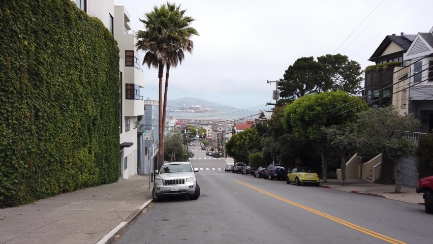 San Francisco, California, USA, June 29, 2022: DOLLY SHOT - Alcatraz Island view from Leavenworth street.