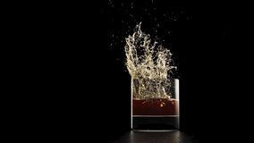 Ice Drop Into Glass of Whisky- Slow Motion - Powered by Shutterstock - Get 15% off with code: PIKWIZARD15