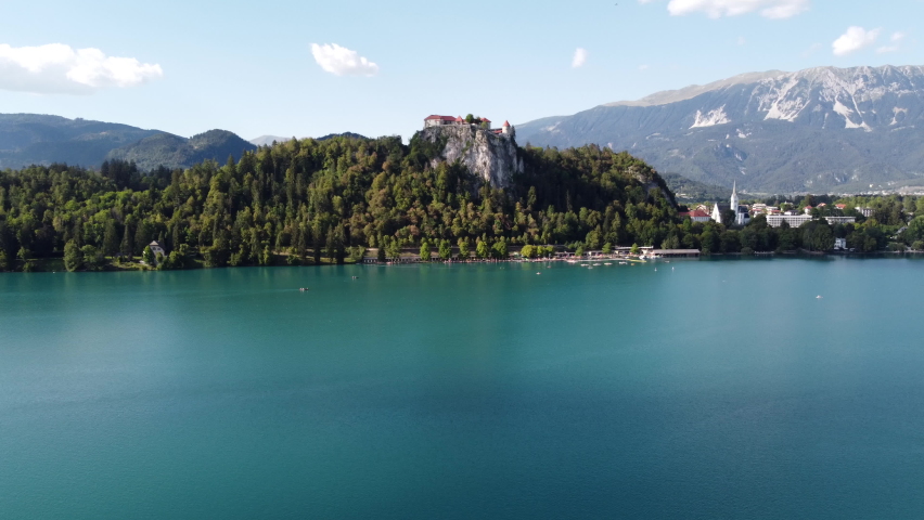 Panoramic aerial shot of castle on a lake