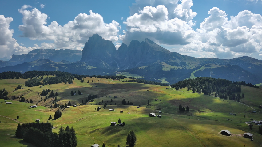 Seiser Alm meadows in Dolomites Italy. Aerial view of travel destination Alpe di Suisi mountain valley in Alps of South Tyrol alps mountains drone video in 4k.