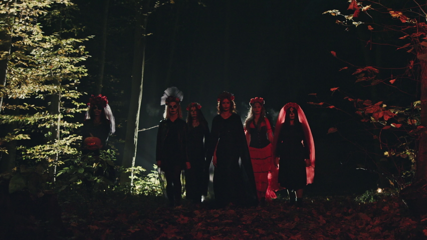Spooky women walking in forest