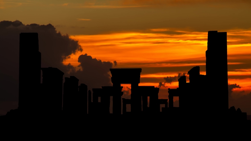 Persia: Ruins of Tachara, the Palace of Darius the Great in Persepolis, Time Lapse at Sunset with Red Sun and Fiery Sky, Unesco Site in Iran