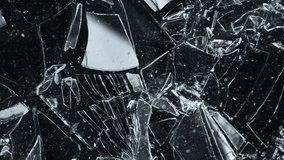 Super Slow Motion Shot of Breaking Real Glass at 1000 fps. Isolated on Black Background. - Powered by Shutterstock - Get 15% off with code: PIKWIZARD15