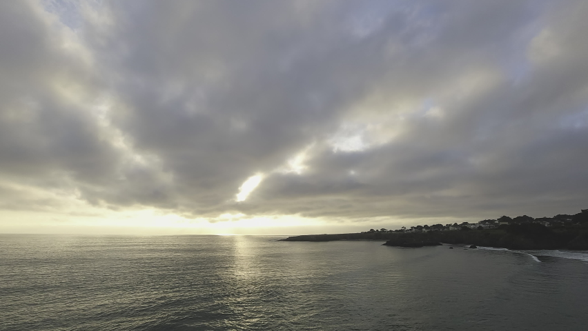 Cloudy Sunset over Mendocino Bay with Silhouetted Town Timelapse
