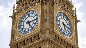 Close up view of the Big Ben time lapse video. Clock face of Elizabeth Tower in Westminster, London, UK.  Arrow moving through time.