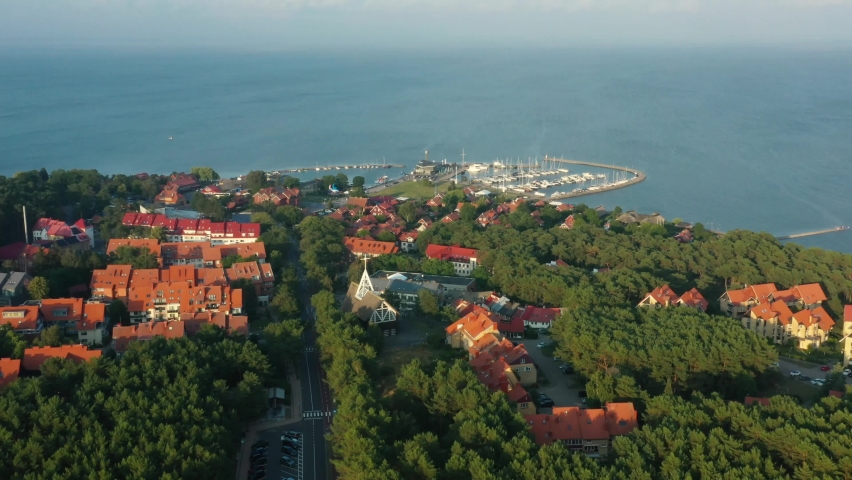drone footage of Nida town in Lithuania, harbor and town can be seen in this clip, shot at sunny summer day Royalty-Free Stock Footage #1095522461