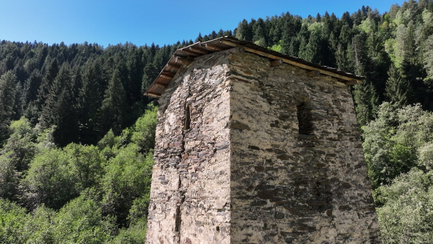 Aerial view of Tower of Love in Village Kala on the road that separates Mestia from Ushguli, the most remote village in the Caucasus mountains, in the Svaneti region of Georgia.