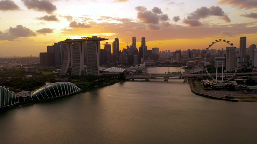 Drone Aerial view 4k Footage of Gardens By The Bay, Flying Towards Skyline Singapore. Marina Bay In Singapore. sunset Royalty-Free Stock Footage #1095537835