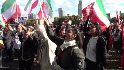 THE HAGUE, NETHERLANDS – OCTOBER 8 2022: Emotional protesters chant slogans in Persian during support demonstration with people in Iran, after the death of Mahsa Amini Adlı Haber Amaçlı Stok Video