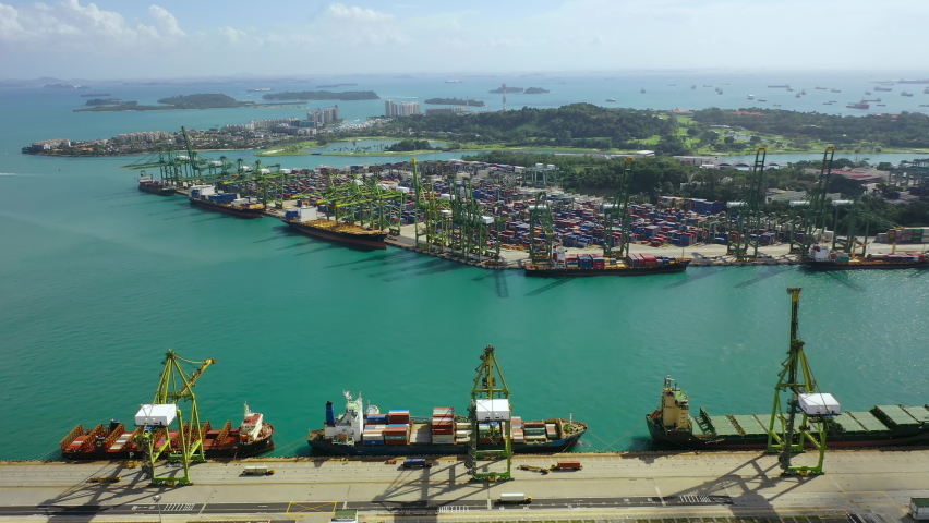 Drone Aerial view 4k Footage of Shipping Containers In Port Of Singapore. Shipping Container Terminal In Singapore City Royalty-Free Stock Footage #1095543963