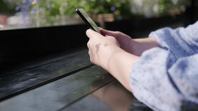 Women holding cell phone using smartphone device in a street cafe. Woman blogger subscribing new social media, buying in internet, ordering products online in apps. - Powered by Shutterstock - Get 15% off with code: PIKWIZARD15