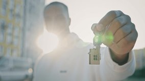 African happy homeowner client real estate agent winner healthy man sportsman hold keys of modern house building in city sold new apartment promoting housing improvement buy dwelling property purchase - Powered by Shutterstock - Get 15% off with code: PIKWIZARD15