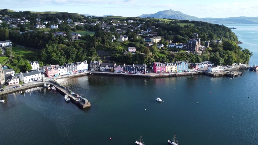Balamory Tobermory Fishing Village on Isle of Mull Inner Hebrides West Coast of Scotland Aerial Drone Footage Fly Out Royalty-Free Stock Footage #1095563449