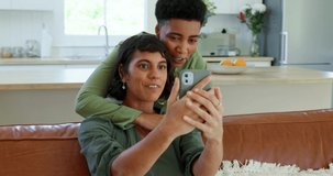 Lesbian couple, phone or video call on sofa in house, home or holiday hotel in communication, live streaming or social media. Smile, happy or hugging lgbtq women lockdown bonding on mobile technology