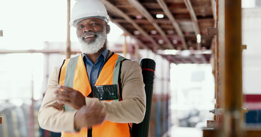 Building engineer, architect and construction worker with a black man standing arms crossed with a positive mindset, motivation and vision on scaffold. Portrait of mature male contractor with a smile Royalty-Free Stock Footage #1095575737