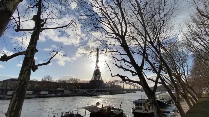 Paris Eiffel Tower and Seine river on Beautiful winter sun
Long shot from France paris Eiffel Tower and Seine river Behing trees, December 2021
