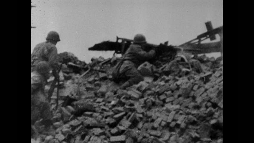 U.S. soldiers fight during the siege of Bastogne at Battle of the Bulge, Ardennes, Belgium, Luxembourg circa December, 1944-January, 1945