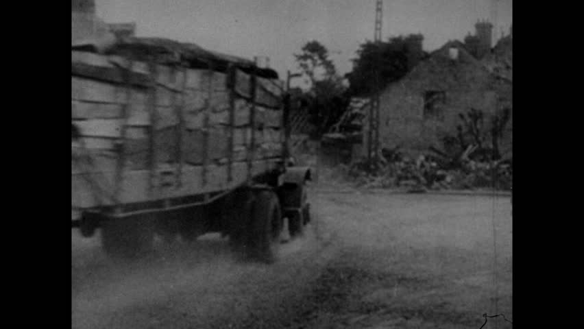U.S. military trucks in Bastogne during Battle of the Bulge, Ardennes, Belgium, Luxembourg circa December, 1944-January, 1945