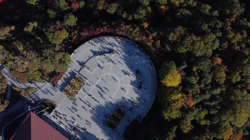 Aerial: families and friends birds eye view in Mont-Royal balcony