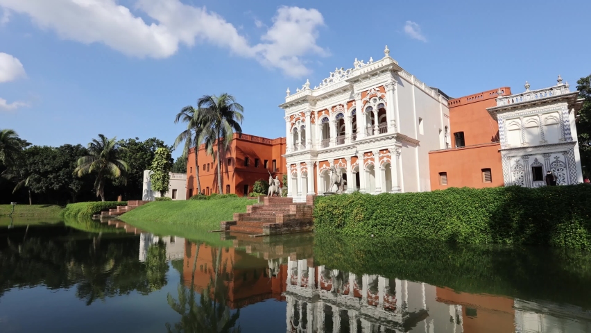 white historical building with blue sky in the city of dhaka