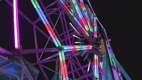 Ferris wheel at night of colorful with outdoor round rotation st Amusement Park, The annual temple event has activities, neon light - Powered by Shutterstock - Get 15% off with code: PIKWIZARD15