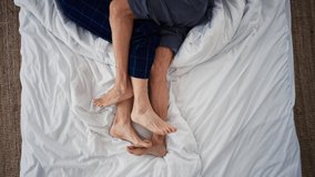 Top view of senior couple lying in bed and hugging each other. - Powered by Shutterstock - Get 15% off with code: PIKWIZARD15