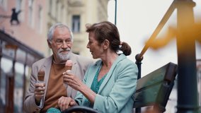 Elegant senior couple in love dating, having ice cream. - Powered by Shutterstock - Get 15% off with code: PIKWIZARD15